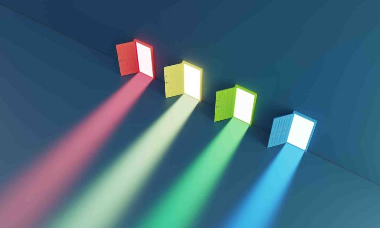 image of five brightly lit colored doors on a blue wall, each slightly open and projecting a beam of light, used to represent the multiple strategic paths in b2b inbound marketing and the importance of choosing the right agency and approach for complex technical buying journeys